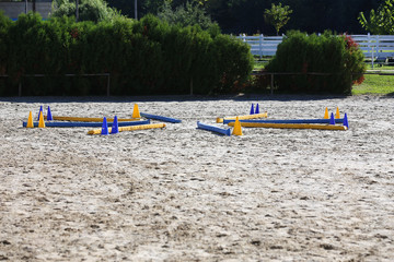 Various colorful obstacles for equestrian training