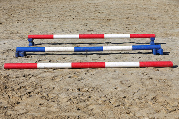 Various colorful obstacles for equestrian training