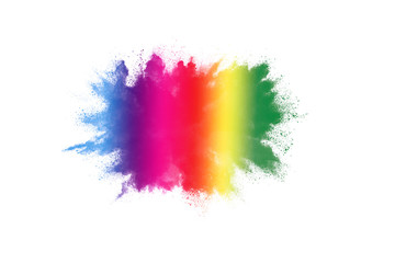 Freeze motion of colorful color powder exploding on white background.  Paint Holi.
