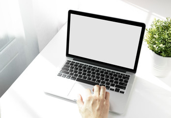 Fototapeta premium Mockup image of a man working at the laptop