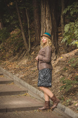 Lady walk in autumn park, fashionable woman in casual style outdoors portrait