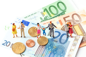 miniature older couple and generation of family standing on euro banknote and coins isolate on white background,  Image for money management  concept.