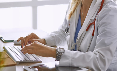 young woman doctor takes patient in office