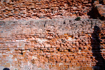 vintage natural brick wall with a lot of ancient patina