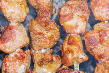 grilled meat over charcoal skewers