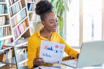Business professionals. Business woman analyzing data using computer while spending time in the...
