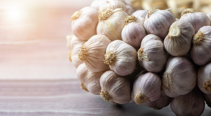 closeup  garlic (Allium sativum) bulb pile  on white background. it native to central asia and northeastern iran, it use as food flavoring and traditional medicine