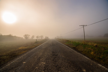 Lonely road with fog