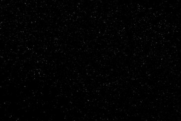 Chaotic white bokeh on a black background, light spots texture, abstraction, falling snow, starry sky, bright glare of light texture