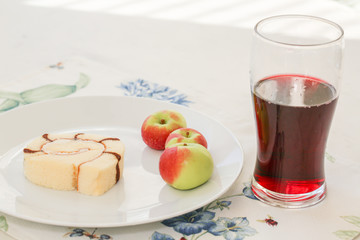Tasting of wine and chocolate cake and small apple. - Image