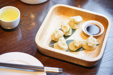 Chinese food. dumplings stuffed with fish ball inside, served for appetizer or dimsum. Window light, soft focus.
