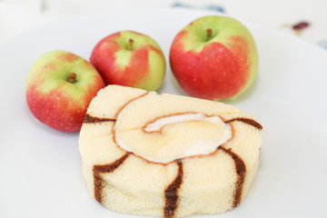Chocolate cake and small apples- Image