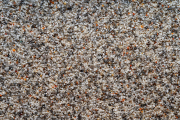 Natural colored marble chips background texture. Decorative marble plaster for indoor and outdoor use. Coarse-grained stone. quartz sand