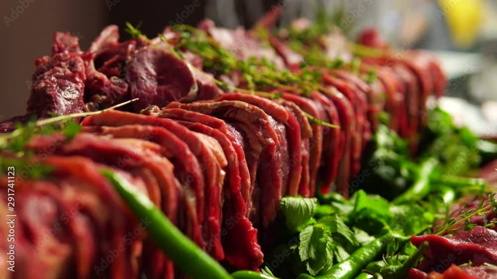 Wall mural Raw meat. Cut pieces of meat for cooking on the grill.