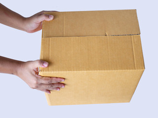 Hand holding brown box