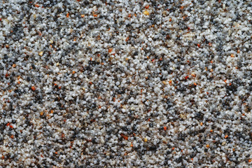 Natural colored marble chips background texture. Decorative marble plaster for indoor and outdoor use. Coarse-grained stone. quartz sand