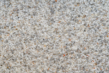 Natural colored marble chips background texture. Decorative marble plaster for indoor and outdoor use. Coarse-grained stone. quartz sand