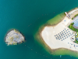 Aerial top down view of Mina de São Domingos, Tapada Grande River Beach lagoon, famous tourist destination, Alentejo, Portugal.