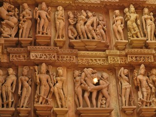 Ancient bas-relief at famous erotic temple in Khajuraho, India. Most Khajuraho temples were built...