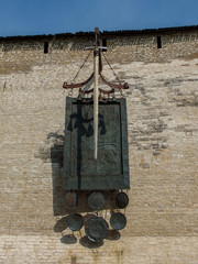 Shield and sword on the wall of the Pskov Kremlin.