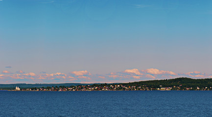 Obraz premium panorama of the lake and the little village on its far shore
