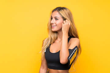 Fototapeta premium Young sport woman over isolated background