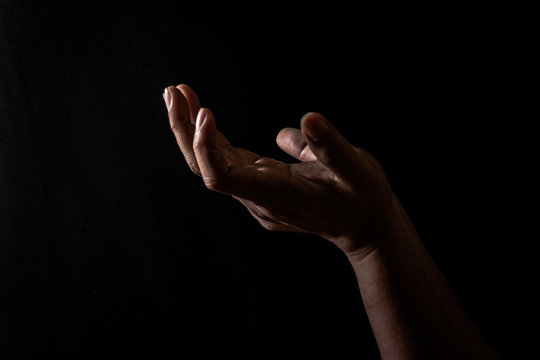praying hand for god, hand for pray to hope in the black background, Hand symbol for believe to jesus and god 