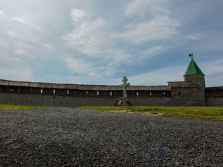 A cross in the center of the yard of the Pskov Kremlin.