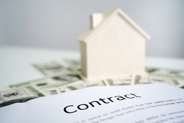 Loan,Contract and residential investment concept. Contract of loan and estate agreement for investor or buyer to sign for getting approval form the bank.