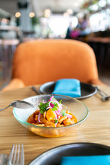 Shrimp ceviche with tigers milk, avocado, and sweet potato on restaurant table