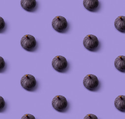 Seamless pattern with fresh ripe figs on a purple background
