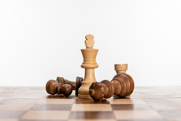 chess figures on chessboard isolated on white