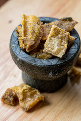Fried Trichogaster pectoralis cut in slice fry for crispy on wooden background, Salid fish thai food