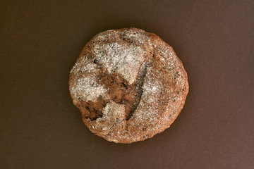 Whole grain rye bread, isolated on dark background. Top view.