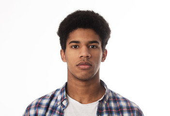 Fototapeta premium Portrait of serious african guy looking at camera