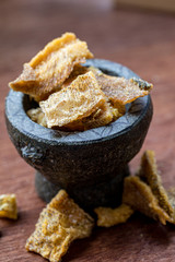 Fried Trichogaster pectoralis cut in slice fry for crispy on wooden background, Salid fish thai food