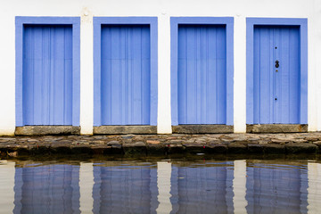 Fototapeta na wymiar Doors and Windows at the center in Paraty, Rio de Janeiro, Brazil. Paraty is a preserved Portuguese colonial and Brazilian Imperial municipality.