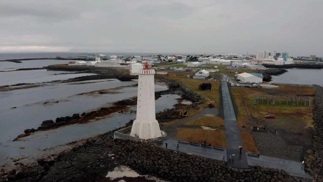 Aerial approaching view of a lighthous on the fishing village of Akranes in West Iceland