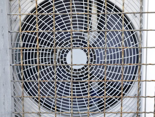 In the photo there is an iron grille and a ventilation system.