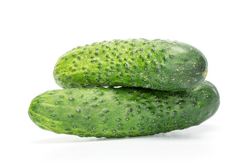 Group of two whole fresh green pickling cucumber isolated on white background