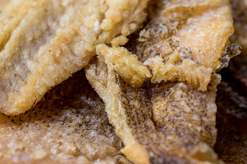 Fried Trichogaster pectoralis cut in slice fry for crispy on wooden background, Salid fish thai food