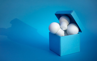 Ideas inspiration concepts with group of lightbulb in blue box on color background space © hakinmhan