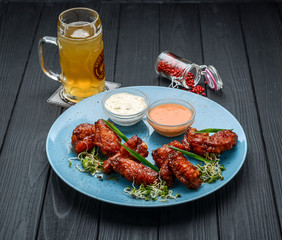 Baked chicken wings in the Asian style on plate