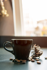 cup of coffee and beans on wooden table