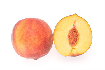 Group of two whole fresh fuzzy peach on grey stone isolated on white background