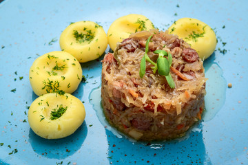 Stewed sauerkraut with sausage on a plate