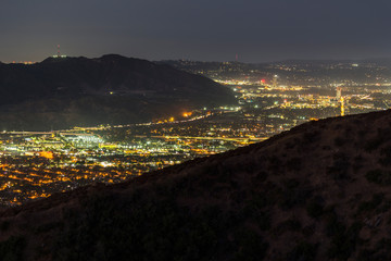 Mountaintop night view of Glendale, Griffith Park and the San Fernando Valley in Los Angeles, California.
