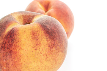 One whole fresh fuzzy peach isolated on white background