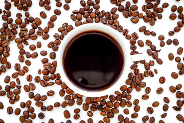 coffee beans on gray with coffe cup table top view