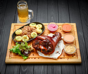 Baked pork shank with sauerkraut with bigus